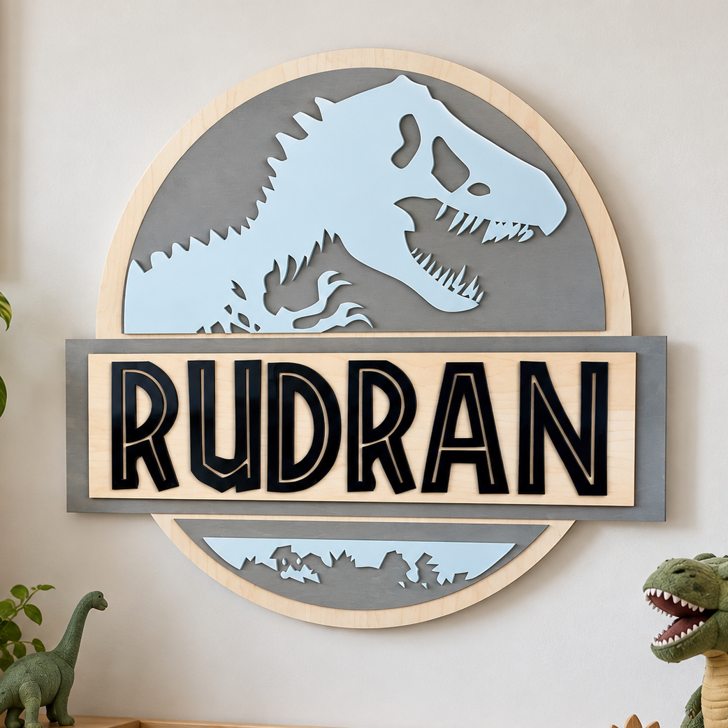 Personalized dinosaur wooden name sign featuring a blue T-Rex silhouette, grey circular backer and black 3D acrylic lettering, displayed on a brick wall.
 Copy