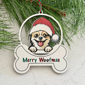 Christmas ornament with a dog wearing a Santa hat and 'Merry Wofmas' text, surrounded by pine branches and berries.