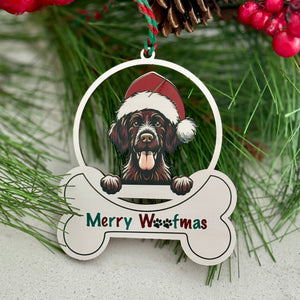 Christmas ornament with a dog wearing a Santa hat and 'Merry Westmas' text, surrounded by greenery and berries.