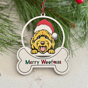 Christmas ornament with a dog wearing a Santa hat and 'Merry Woofmas' text, surrounded by pine branches and red berries.