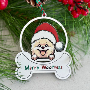 Christmas ornament with a dog wearing a Santa hat and 'Merry Woofmas' text, surrounded by pine branches and berries.