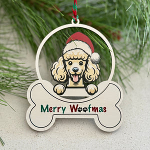 Christmas ornament with a dog design and 'Merry Woofmas' text, surrounded by pine branches and berries.