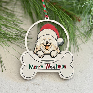 Christmas ornament with a dog wearing a Santa hat and 'Merry Wootmas' text, surrounded by pine branches and berries.