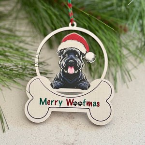 Christmas ornament with a dog wearing a Santa hat and 'Merry Woofmas' text, hanging on a branch with red berries.