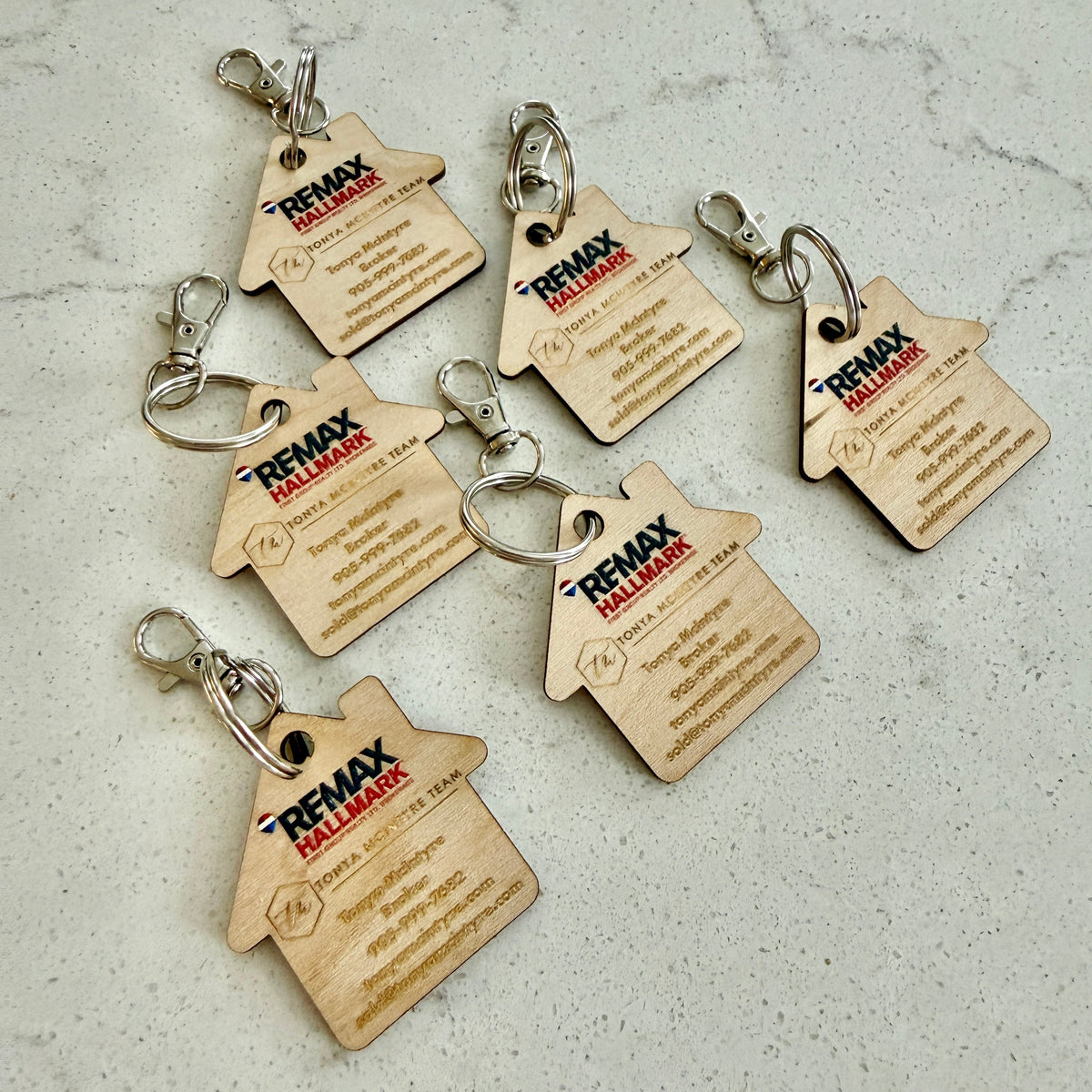 Custom house-shaped realtor keychains with your logo and contact info. Perfect closing gifts, open house giveaways, and everyday brand visibility.