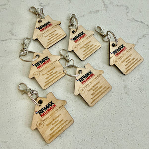 Custom house-shaped realtor keychains with your logo and contact info. Perfect closing gifts, open house giveaways, and everyday brand visibility.