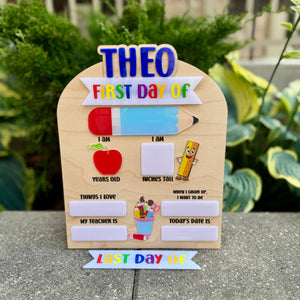Wooden sign with school-themed questions for the first day of school, placed outdoors.