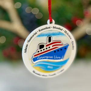 Decorative ornament with a ship design and text on a blurred background