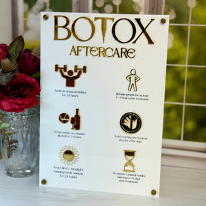 Botox aftercare information sheet with icons on a table with flowers in the background