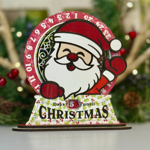 Christmas countdown calendar with Santa Claus design on a white surface.