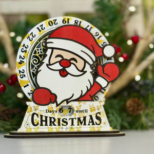 Christmas countdown timer with Santa Claus design on a white surface with a festive background.