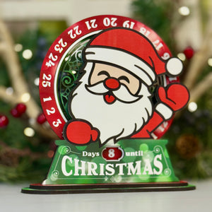 Christmas countdown timer with Santa Claus design on a white surface.