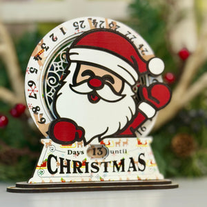 Christmas countdown timer with Santa Claus design on a white surface.