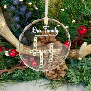 Decorative Christmas ornament with antlers and a message on a Christmas tree.