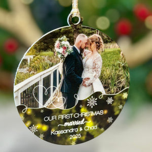 Personalized Christmas ornament with a couple's photo and 'Our First Christmas Married' text against a festive background.