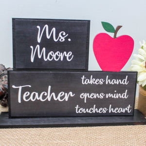 Teacher takes hand, opens mind and touches heart