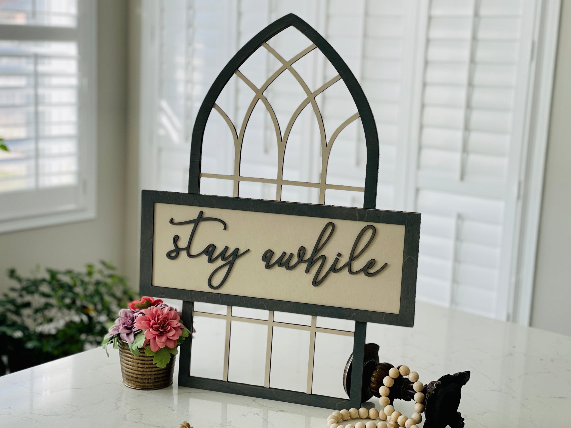 Stay Awhile Sign With Cathedral Arch Window