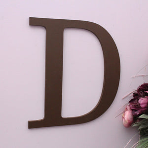 Large brown letter D wooden sign