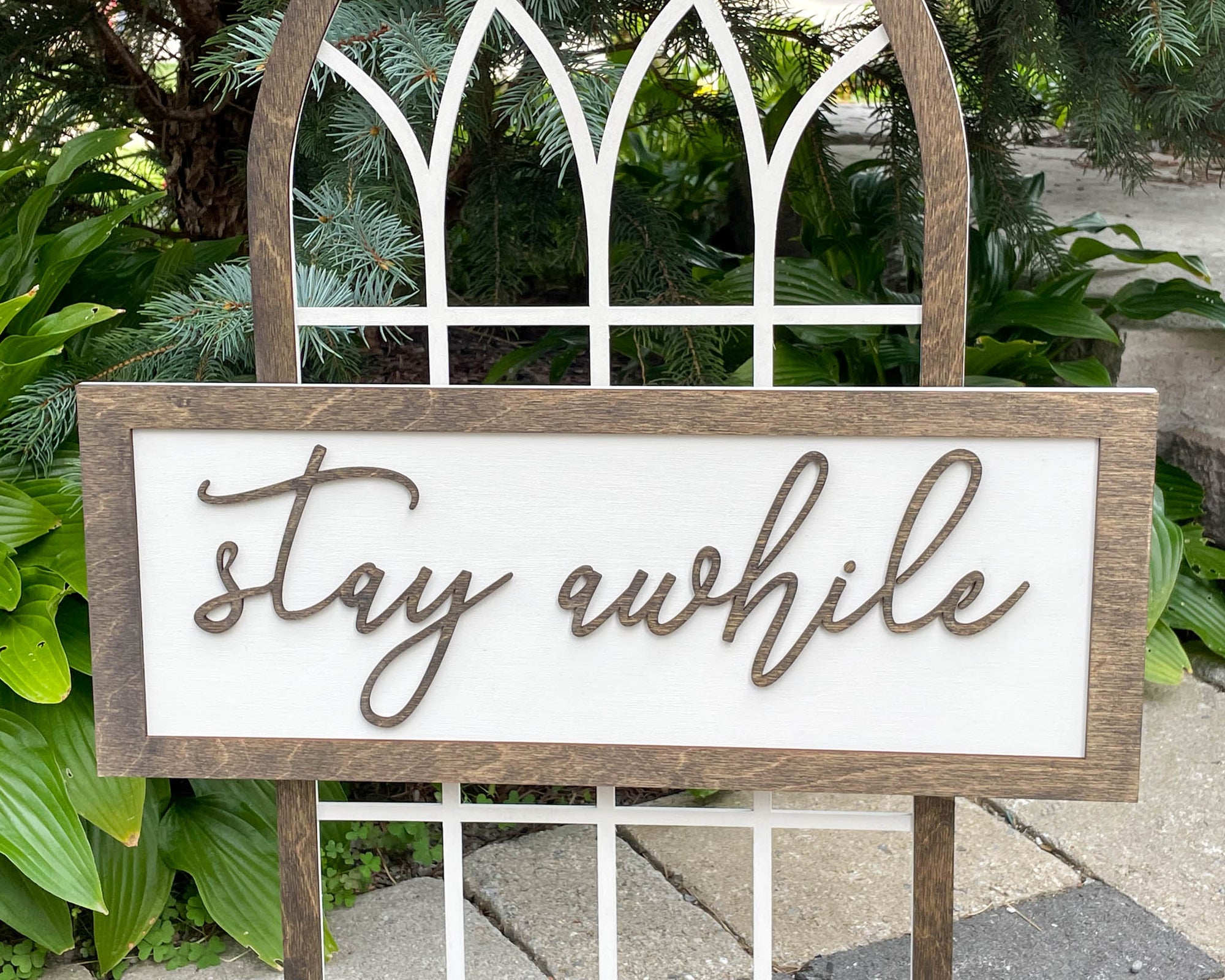 Stay Awhile Sign With Cathedral Arch Window